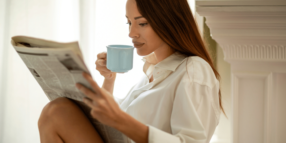 atlanta woman reading a news paper